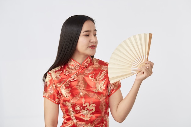 Attractive beautiful Young Asian woman in traditional red cheongsam dress 