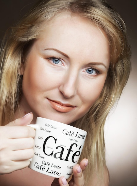 Attractive blond woman with coffee