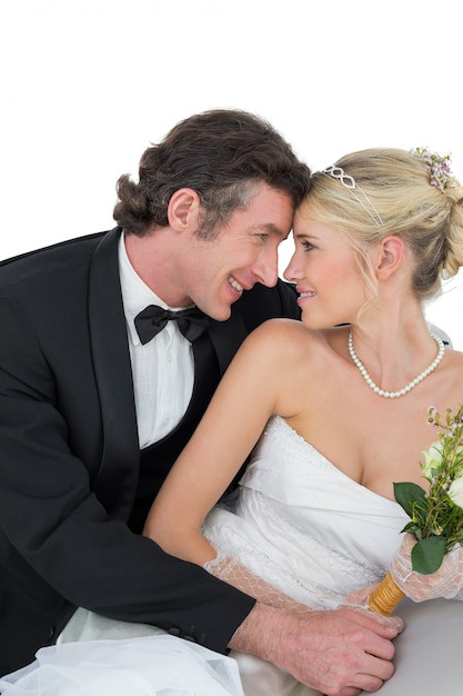 Attractive bride and groom with head to head