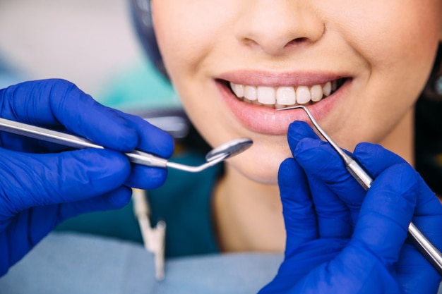 Attractive brunette girl at the dentist consultation