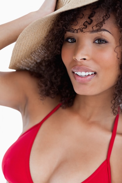 Attractive brunette woman standing in beachwear