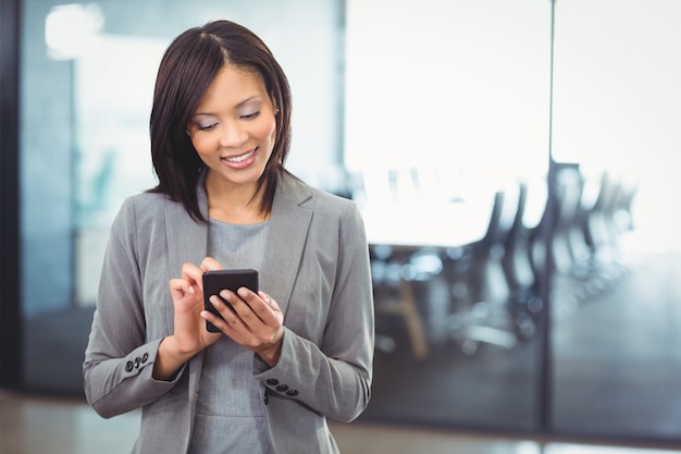 Attractive business woman using mobile phone