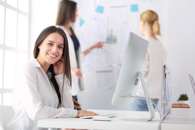 Attractive business woman working on laptop at office Business people