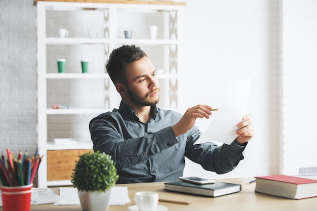 Attractive businessman doing paperwork