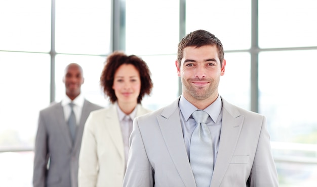 Attractive businessman leading his colleagues