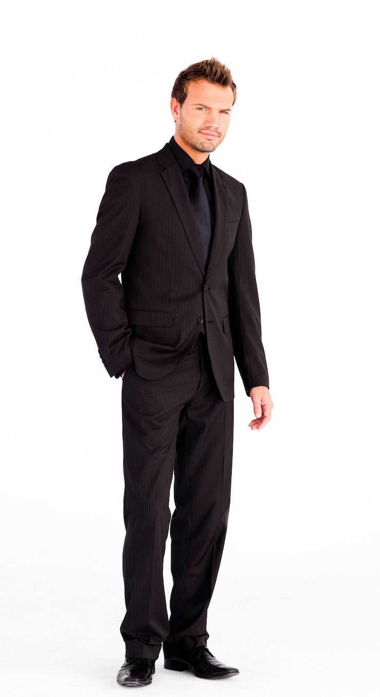 Photo attractive businessman looking at the camera 
