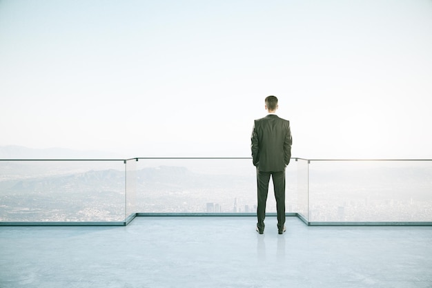 Attractive businessman on rooftop