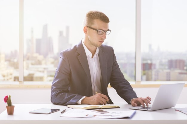 Attractive businessman working on project