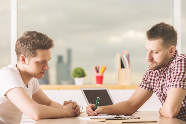 Attractive businessmen with empty laptop