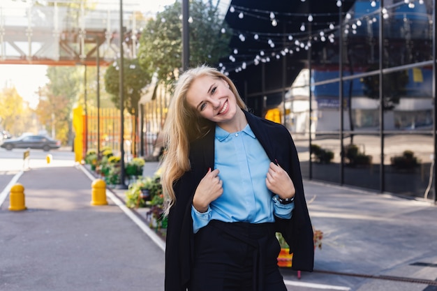 Attractive businesswoman outside the office building