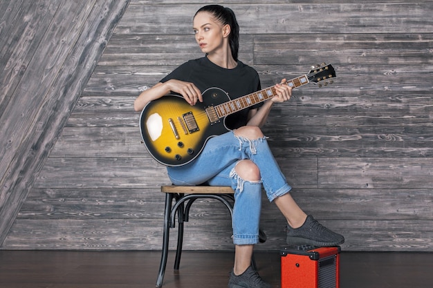 Attractive caucasian girl with guitar