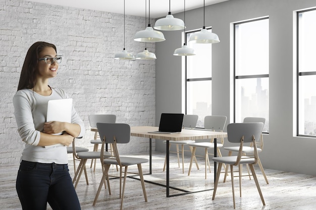 Attractive cheerful woman in conference room