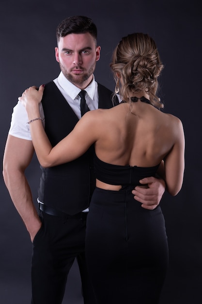 Attractive couple in formal attire isolated