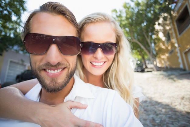 Attractive couple riding a scooter