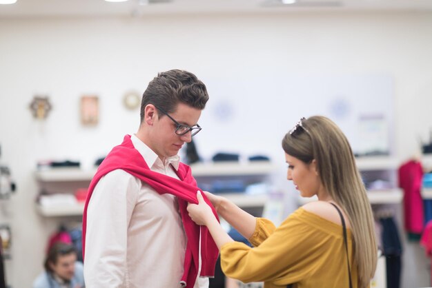 Attractive Couple Shopping In A Man's Clothing Store