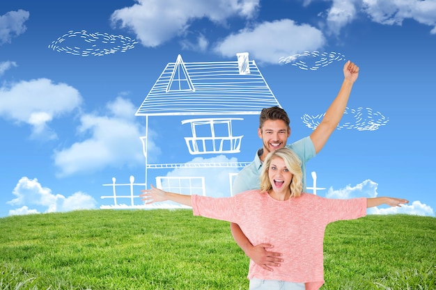 Photo attractive couple smiling and cheering against blue sky over green field