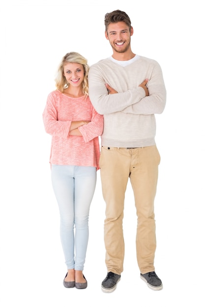 Photo attractive couple smiling with arms crossed