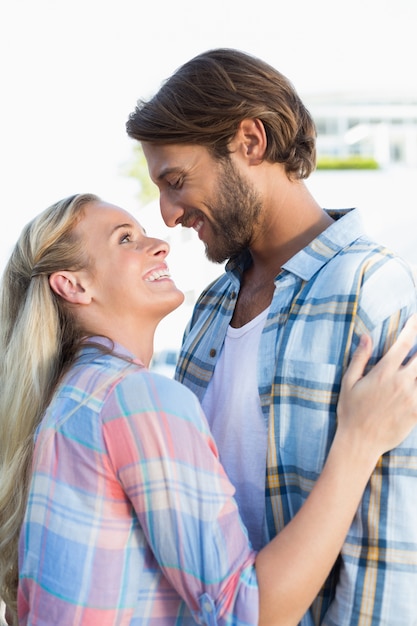 Attractive couple standing and hugging