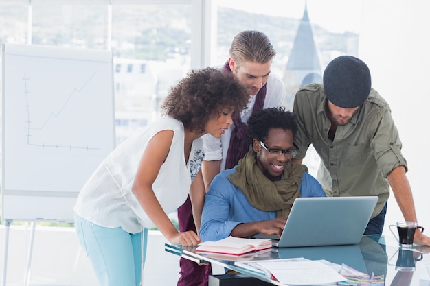 Attractive designers working in office at desk