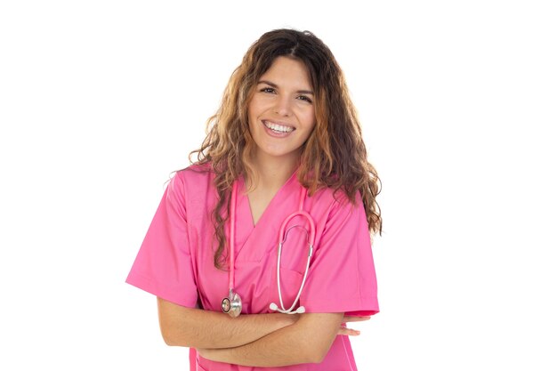 Attractive doctor wearing a pink uniform isolated on a white background