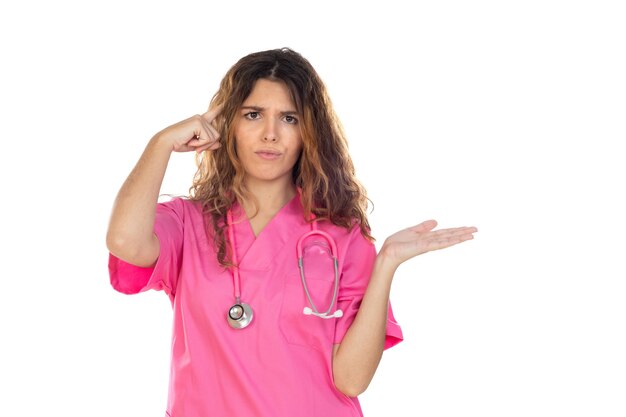 Attractive doctor wearing a pink uniform isolated on a white background