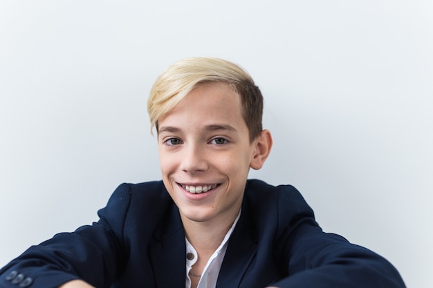 Attractive eleven year old boy with braces on his teeth. Dentistry and teenager concept.