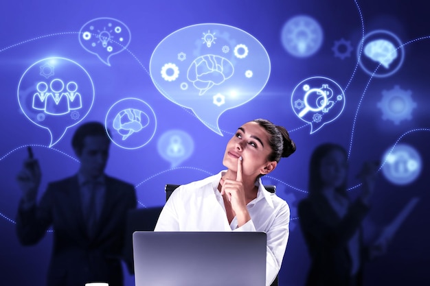 Attractive european businesspeople with devices working on abstract blue background with speech bubbles and brainstorming ai hologram