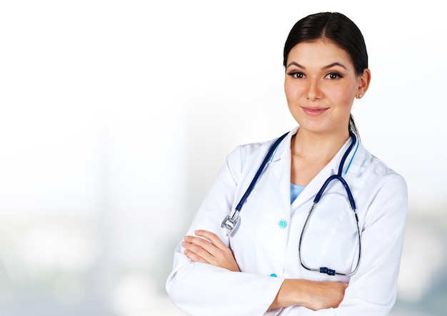 Attractive female doctor  on background