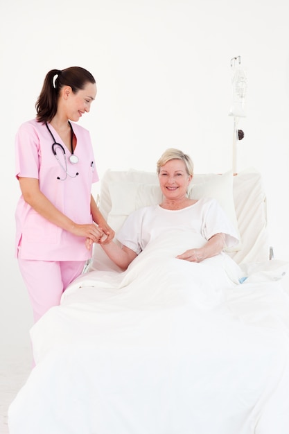 Attractive female doctor examining a patient 