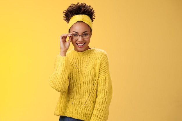 Attractive friendly charismatic female programmer frontend developer smiling broadly check glasses nose look confident lucky have excellent idea improve app workability, standing yellow background.