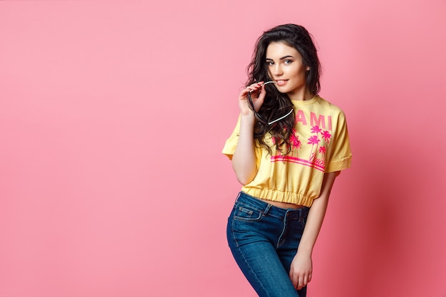 attractive funky teenage woman in yellow t shirt