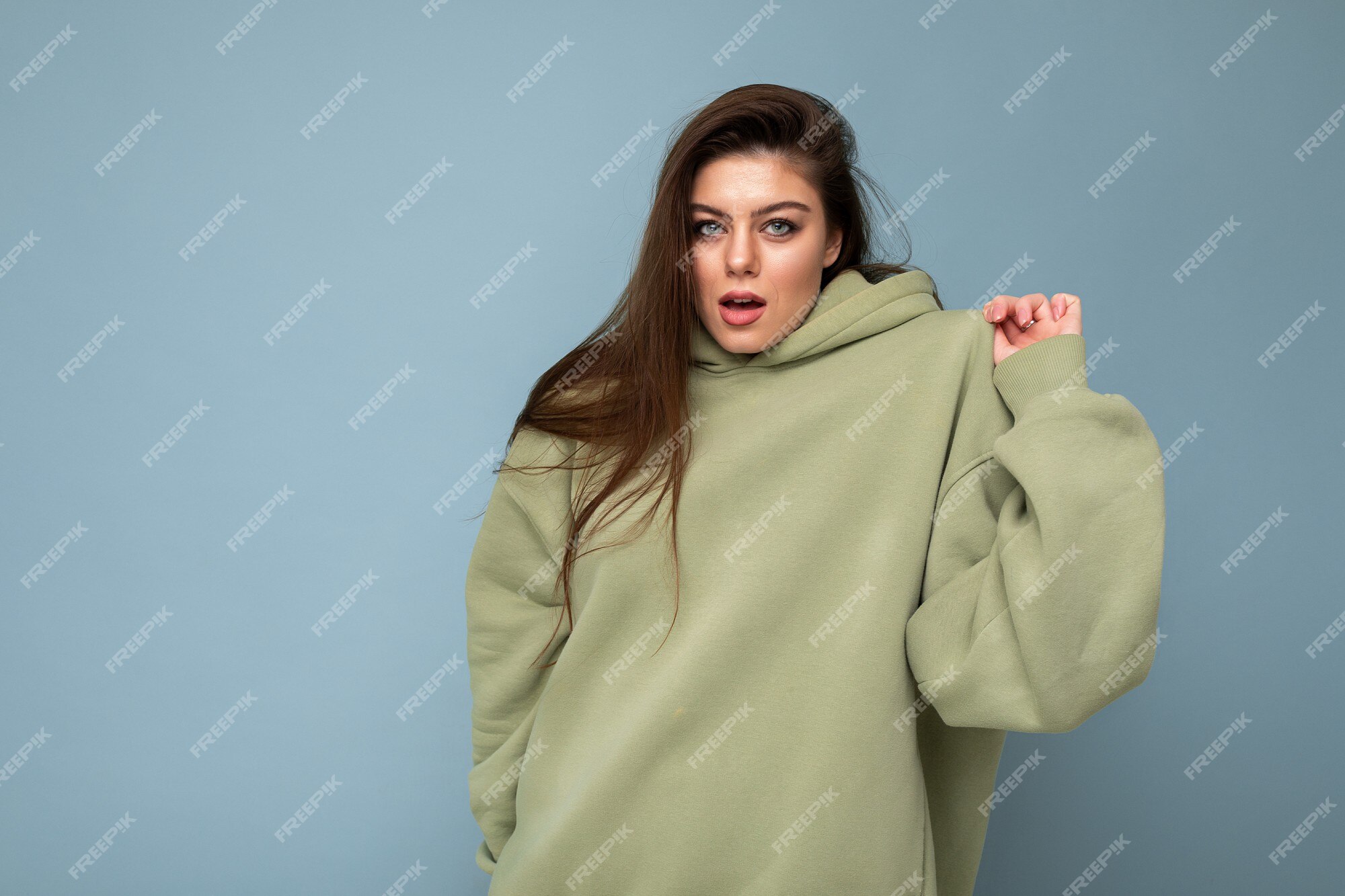 Premium Photo | Attractive funny stylish young woman in a khaki hoodie Premium Photo | Attractive funny stylish young woman in a khaki hoodie