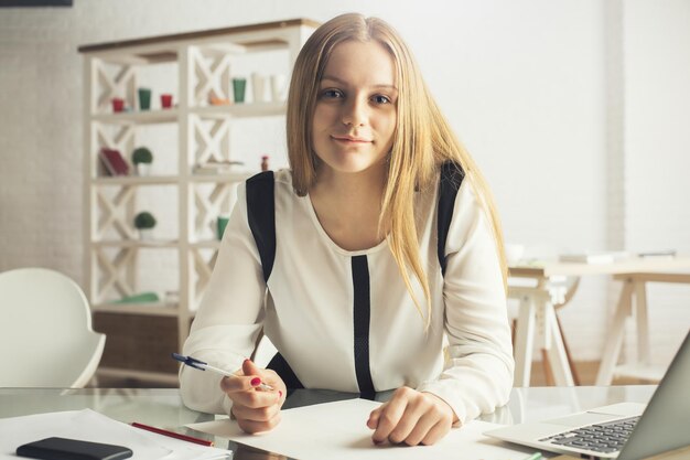 Attractive girl doing paperwork