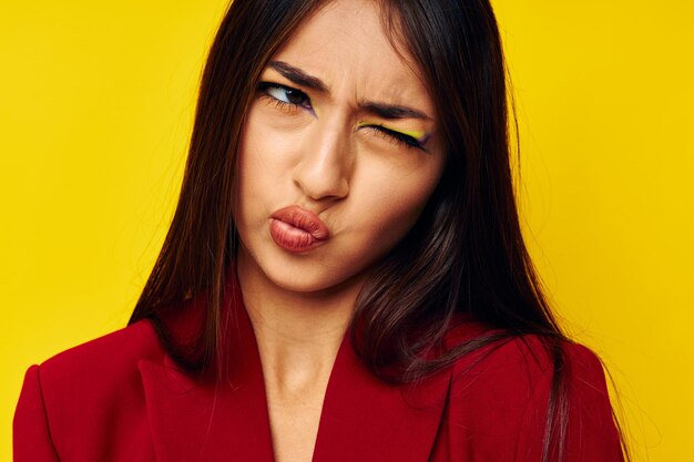 Attractive girl in a red jacket cosmetics smile isolated background unaltered