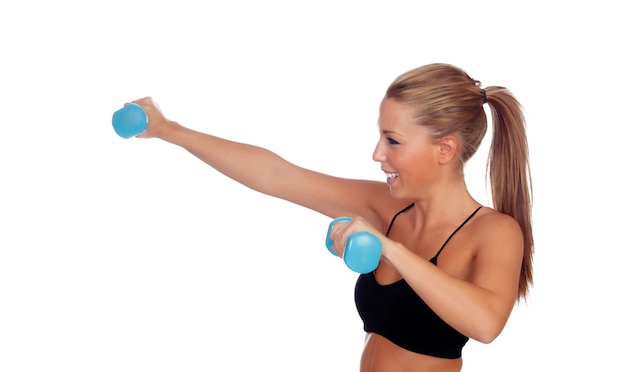 Attractive girl training with dumbbells