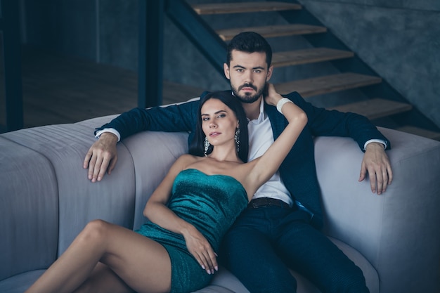 Attractive glamorous couple posing indoors