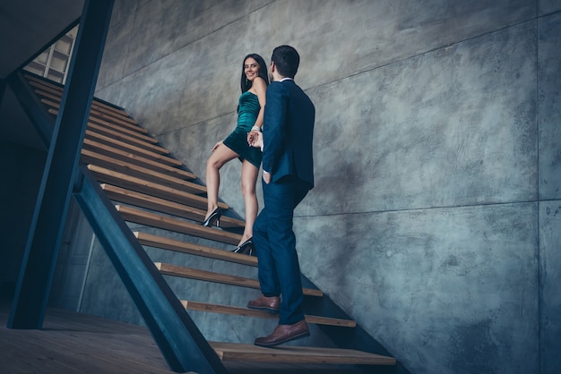 Attractive glamorous couple posing indoors