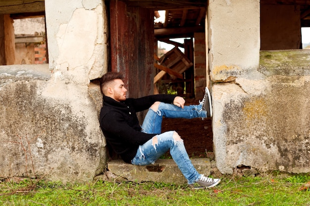 Attractive guy in a old house