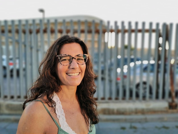 Attractive happy middleaged woman with glasses