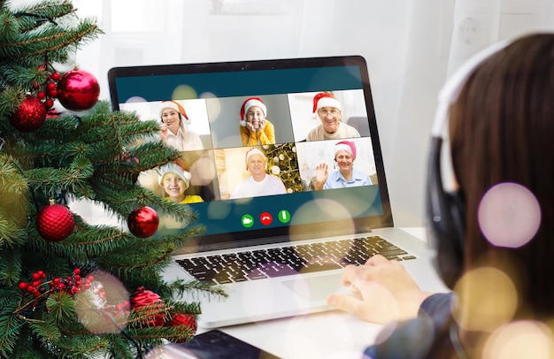 Attractive happy young girl student having video chat, waving. christmas