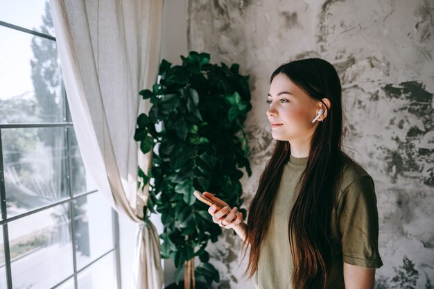 Attractive happy young woman relaxing at home