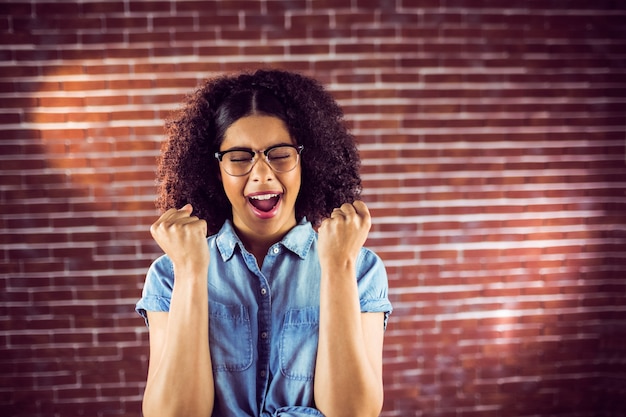 Attractive hipster celebrating success