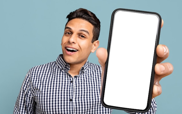 Attractive Hispanic Guy Showing Mobile Phone Mockup