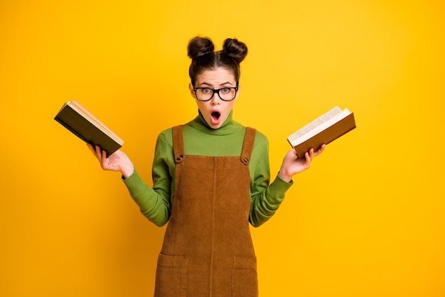 Attractive intellectual girl carrying book science isolated bright vivid shine vibrant yellow color