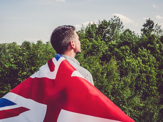 Attractive man holding Australian Flag. National holiday