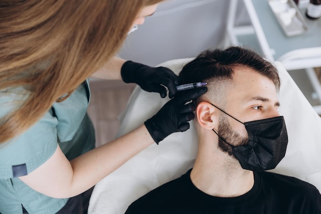 Premium Photo | An attractive man receives mesotherapy injections to treat hair loss at the clinic injections into the skin and scalp Premium Photo | An attractive man receives mesotherapy injections to treat hair loss at the clinic injections into the skin and scalp