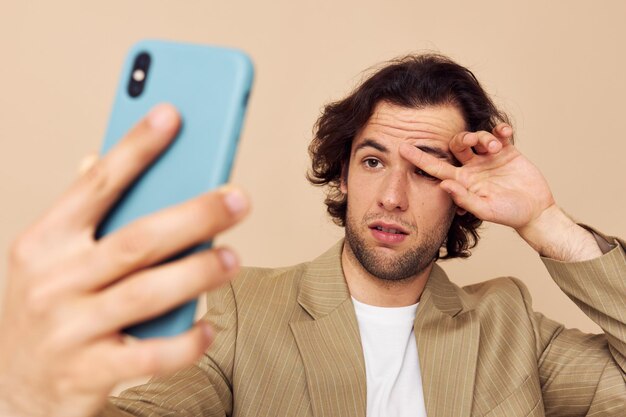 Attractive man takes a selfie classic style technologies isolated background