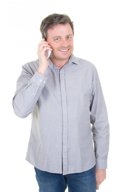 Attractive man talking on the phone and looking away isolated