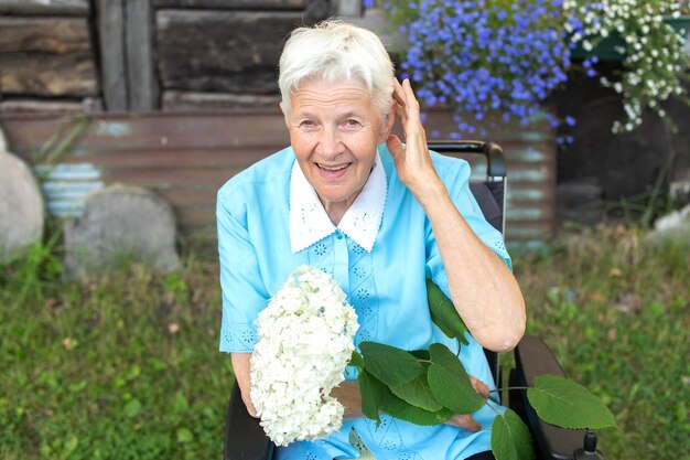 Attractive middleaged woman talks on phone at her workplace