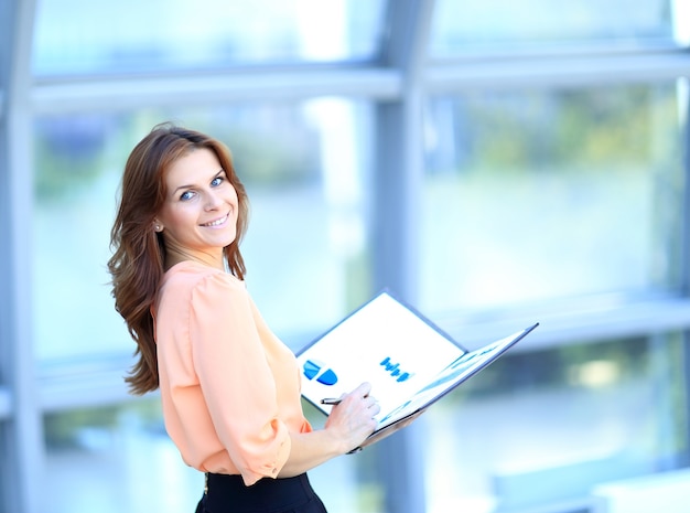 Attractive modern young businesswoman in the office